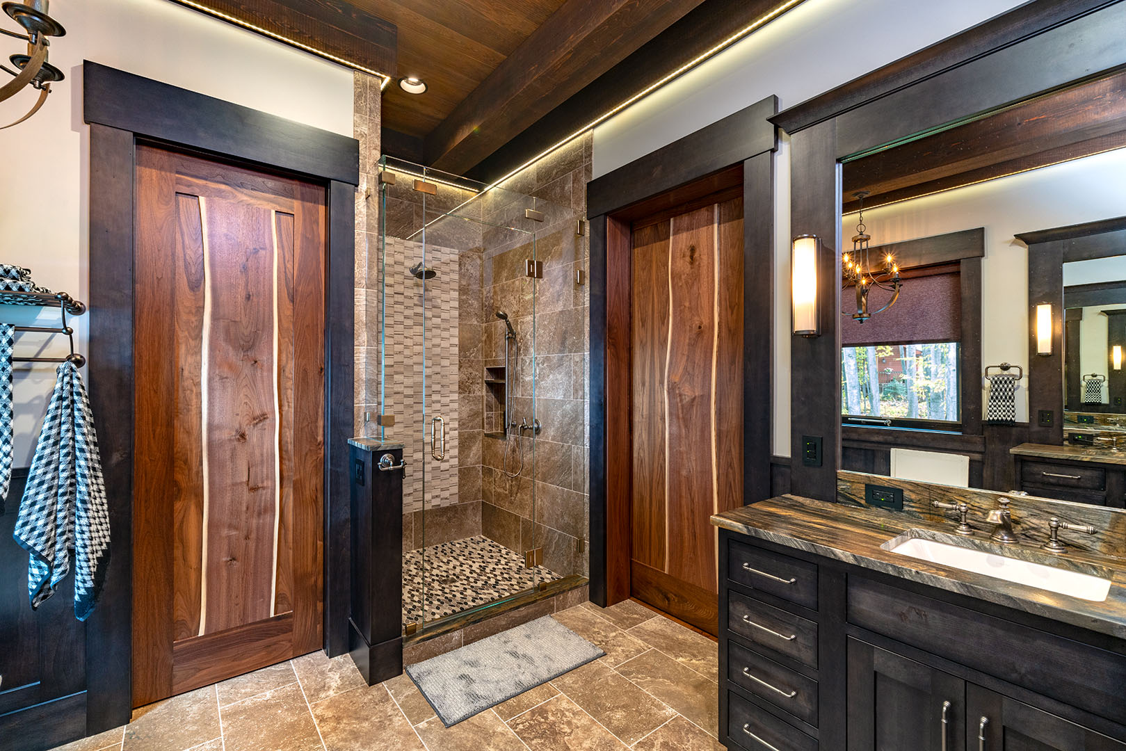 Master bathroom with custom walnut doors